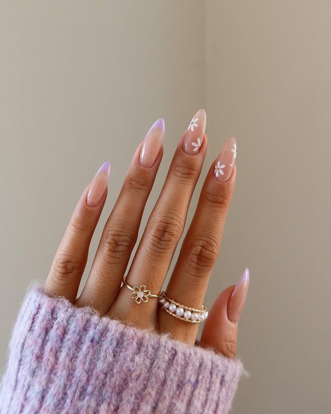 Lavender nails with white floral designs