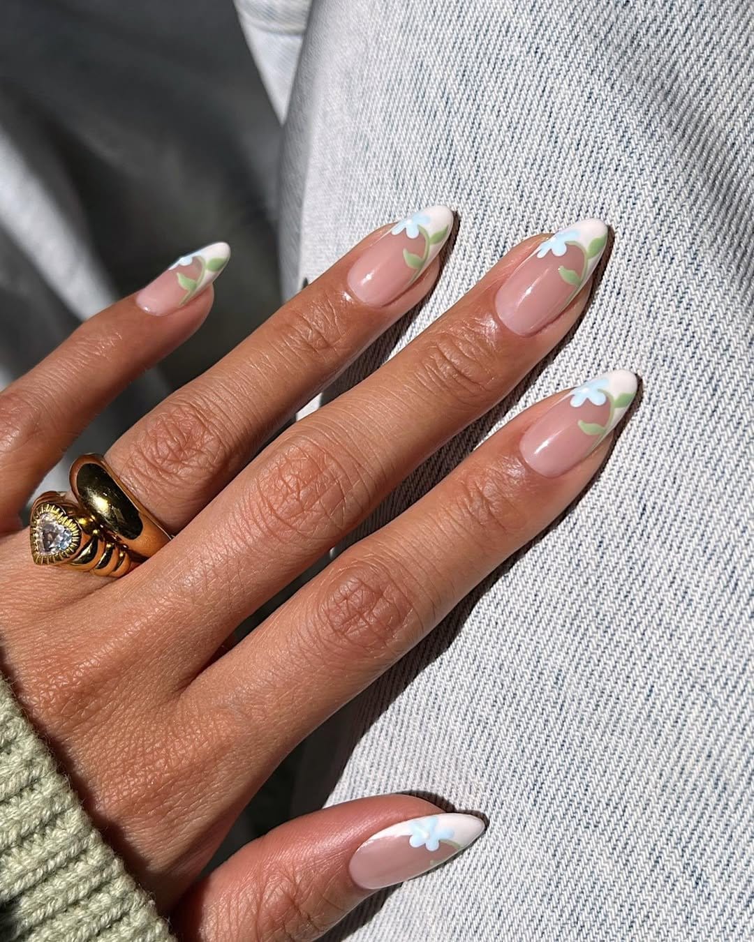 Floral French tip nail design in pastel shades