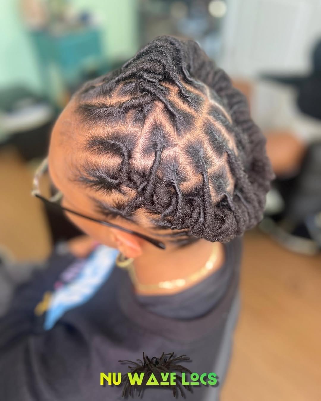 Short locs twisted into a halo crown