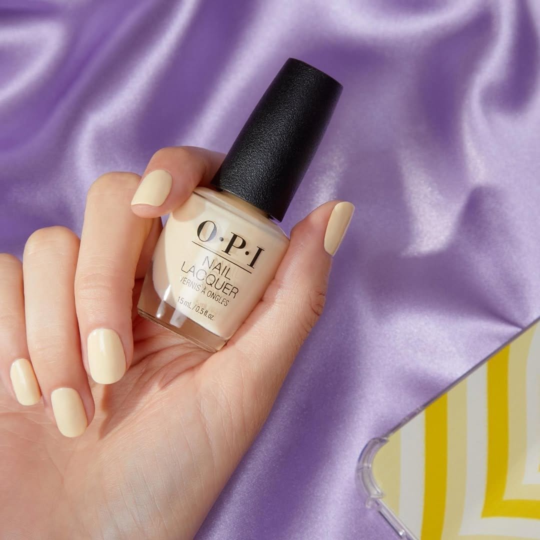 Bright yellow nail polish bottle