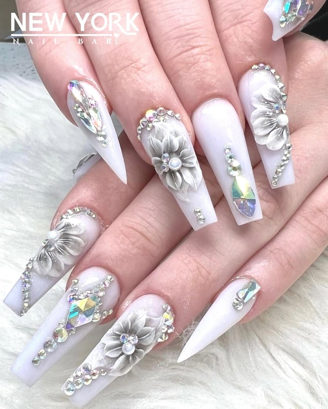 White nails with jewel embellishments