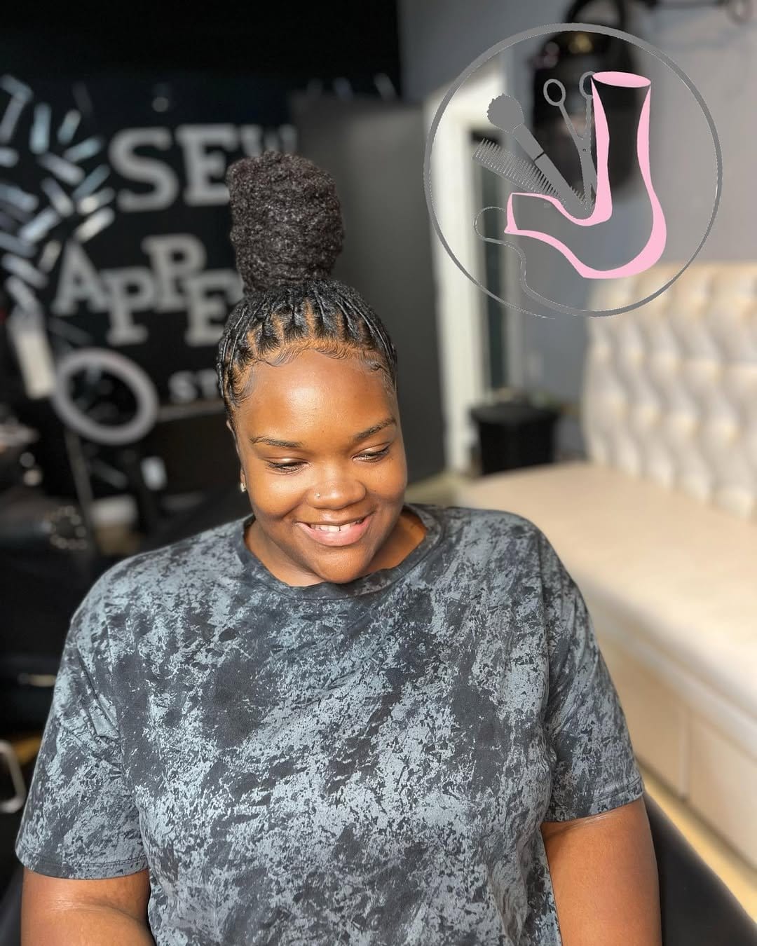Short dreadlocks styled in a top knot
