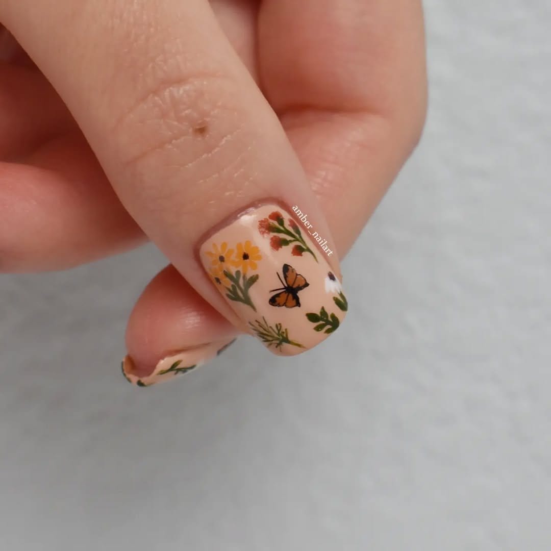 Vintage-inspired floral nail art on pastel base