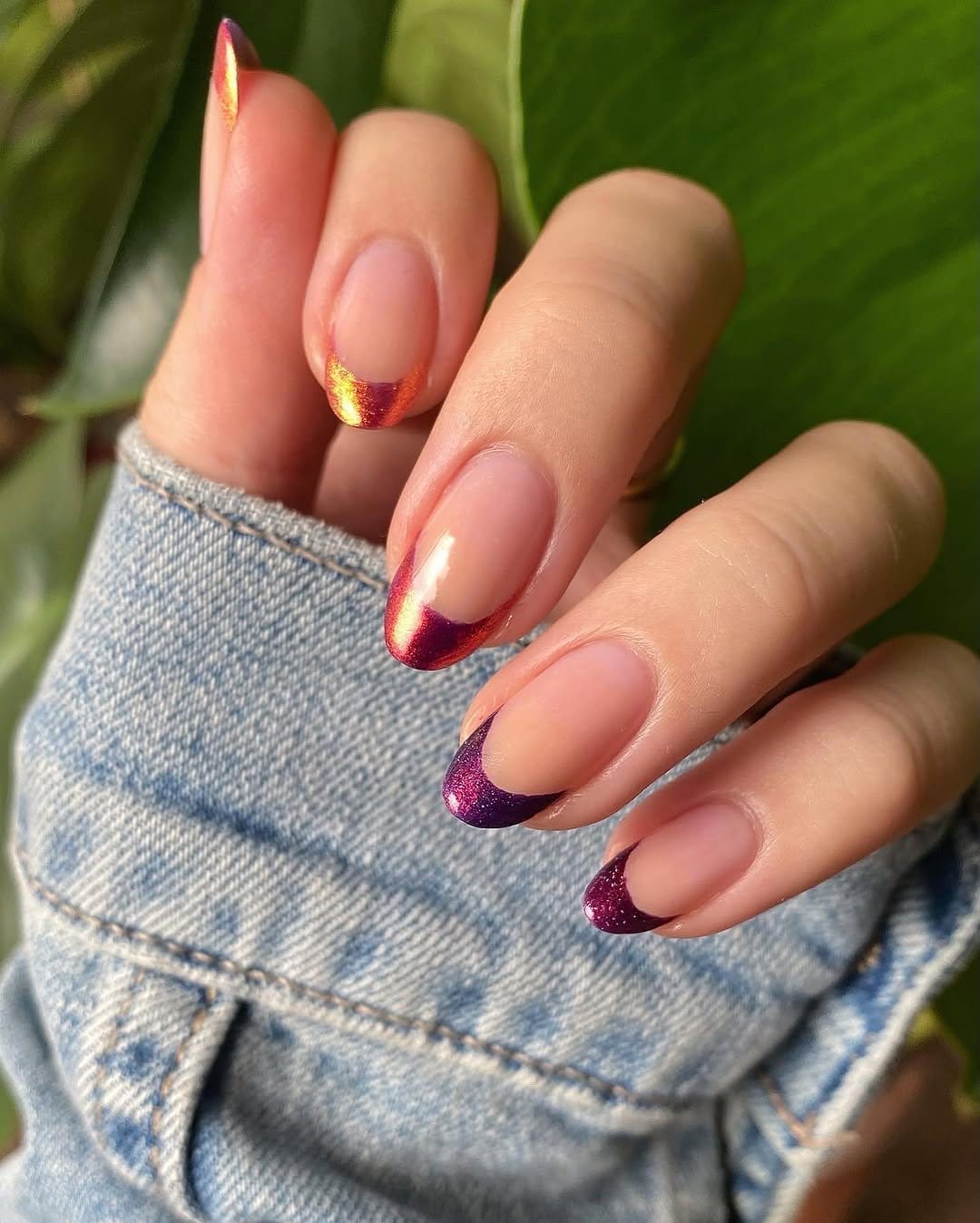 Red ombre nails with shimmering metallic tips