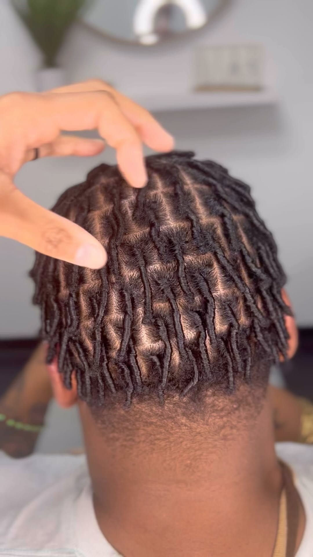 Short locs with spiral curls