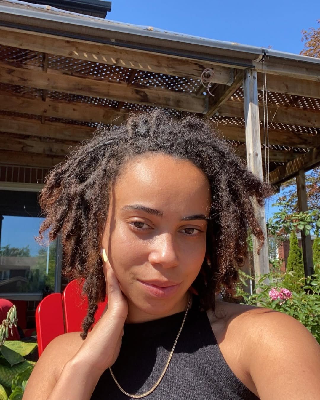 Vibrant headwrap over short locs