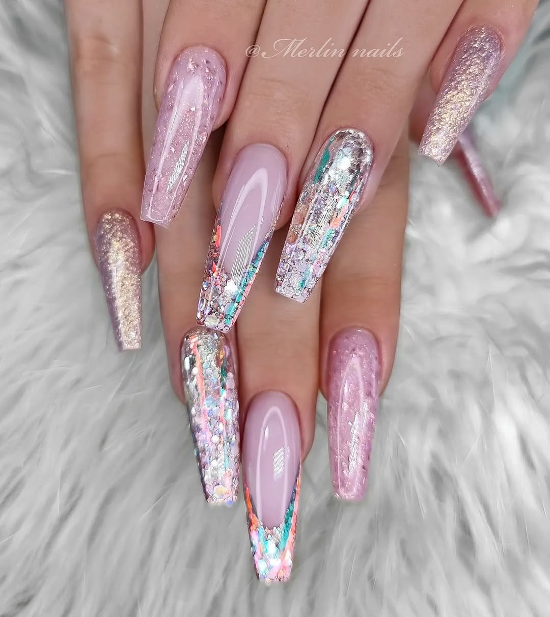 Glamorous pastel pink nails with silver glitter