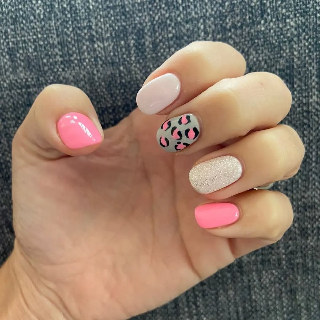 Leopard print on light pink nails