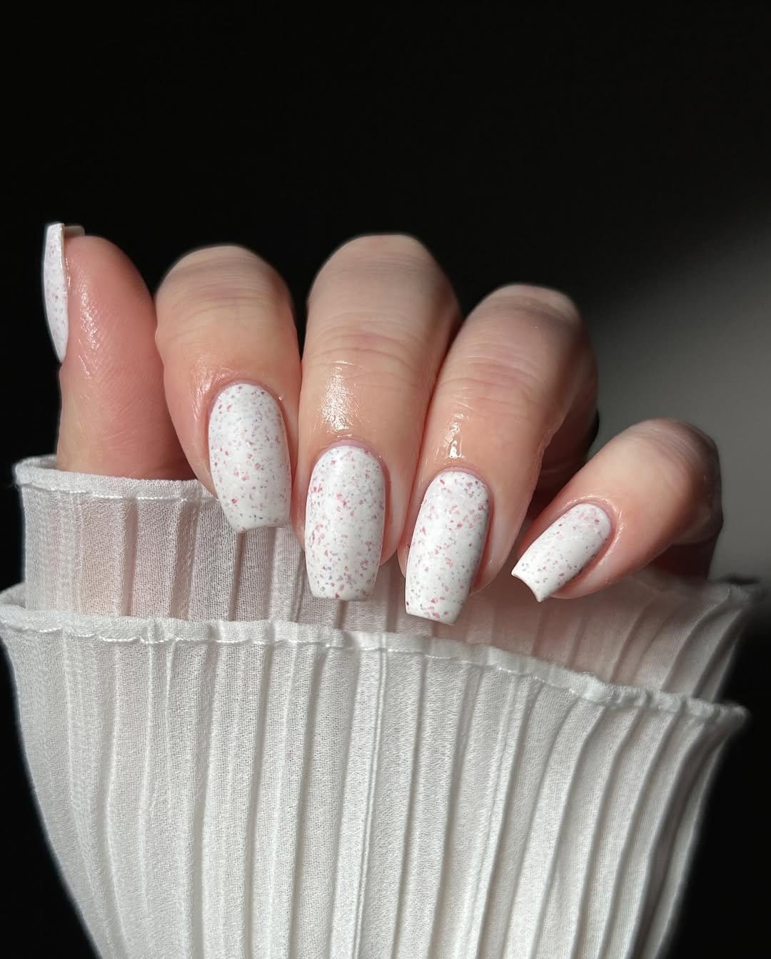 White nails with glitter speckles