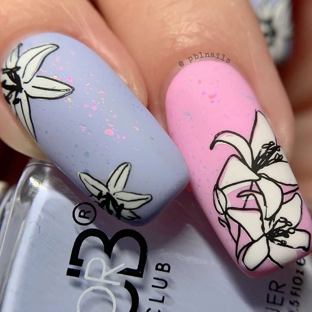 Pastel periwinkle nails with star designs