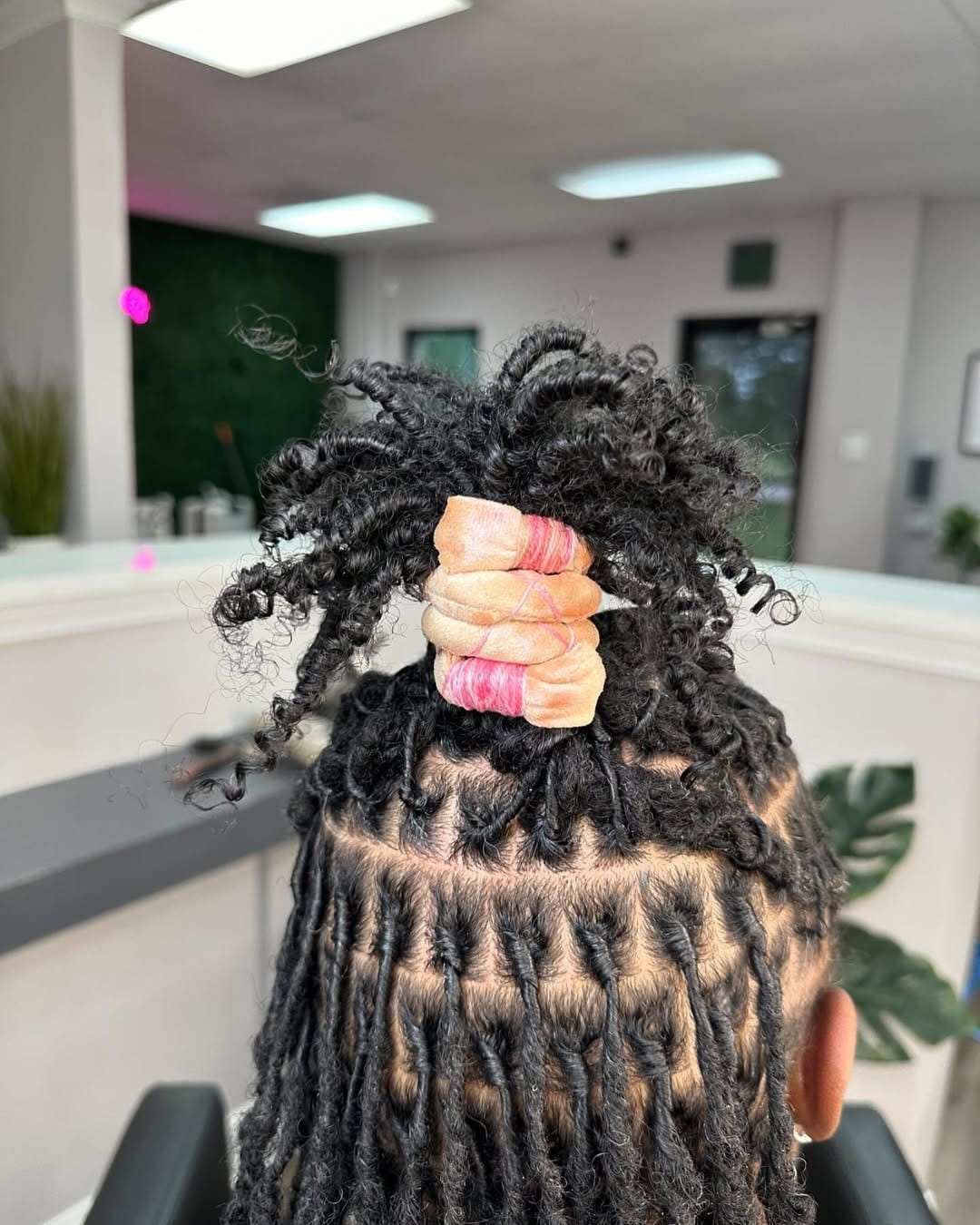 Spiral short dreadlocks with metallic sheen