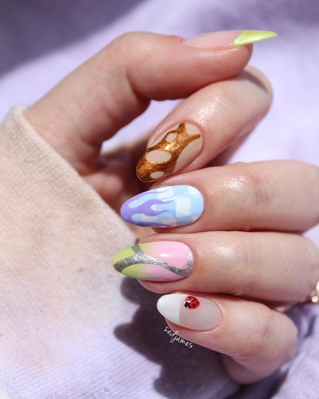 Gentle pastel seafoam green ombre nails with ocean backdrop