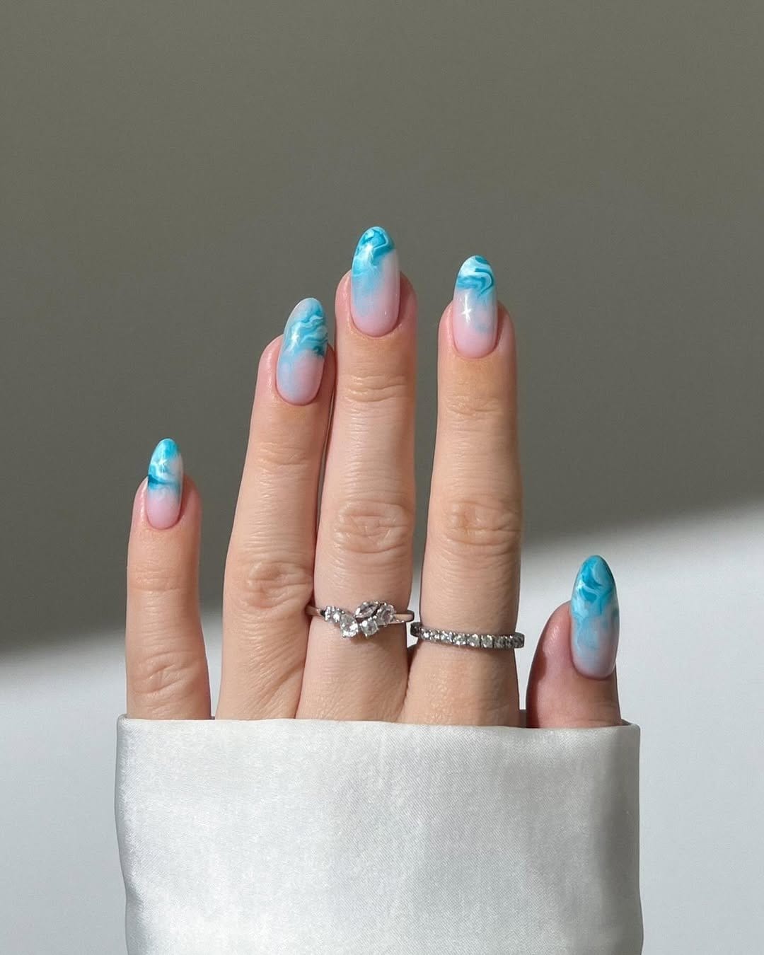 Gradient pastel nails with floral patterns
