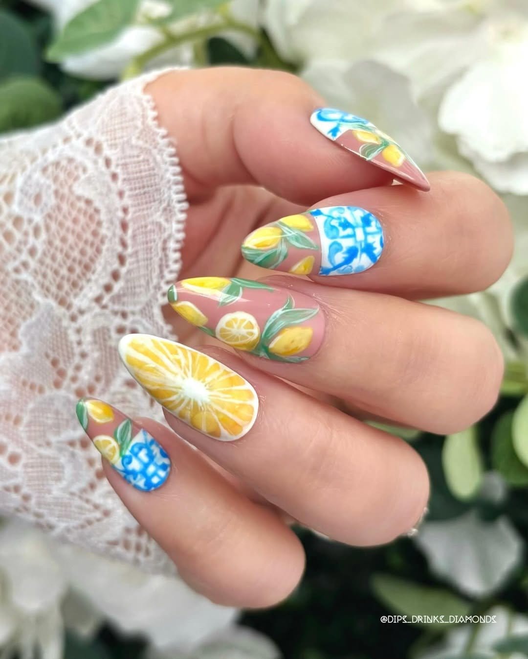 Pastel yellow nails with lemon slice design