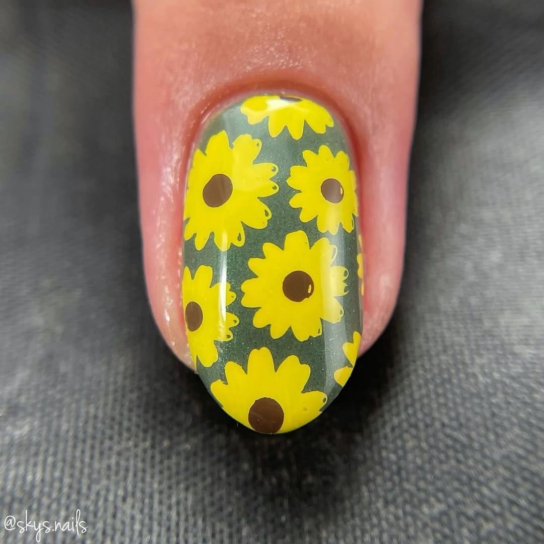 Sunflower-themed nails with bright yellow petals