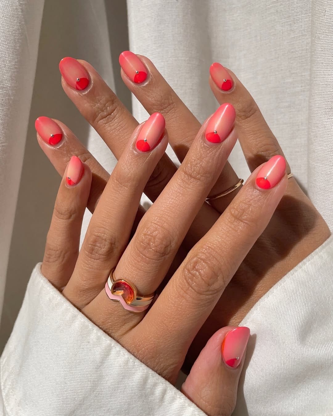 Red nails with coral accents