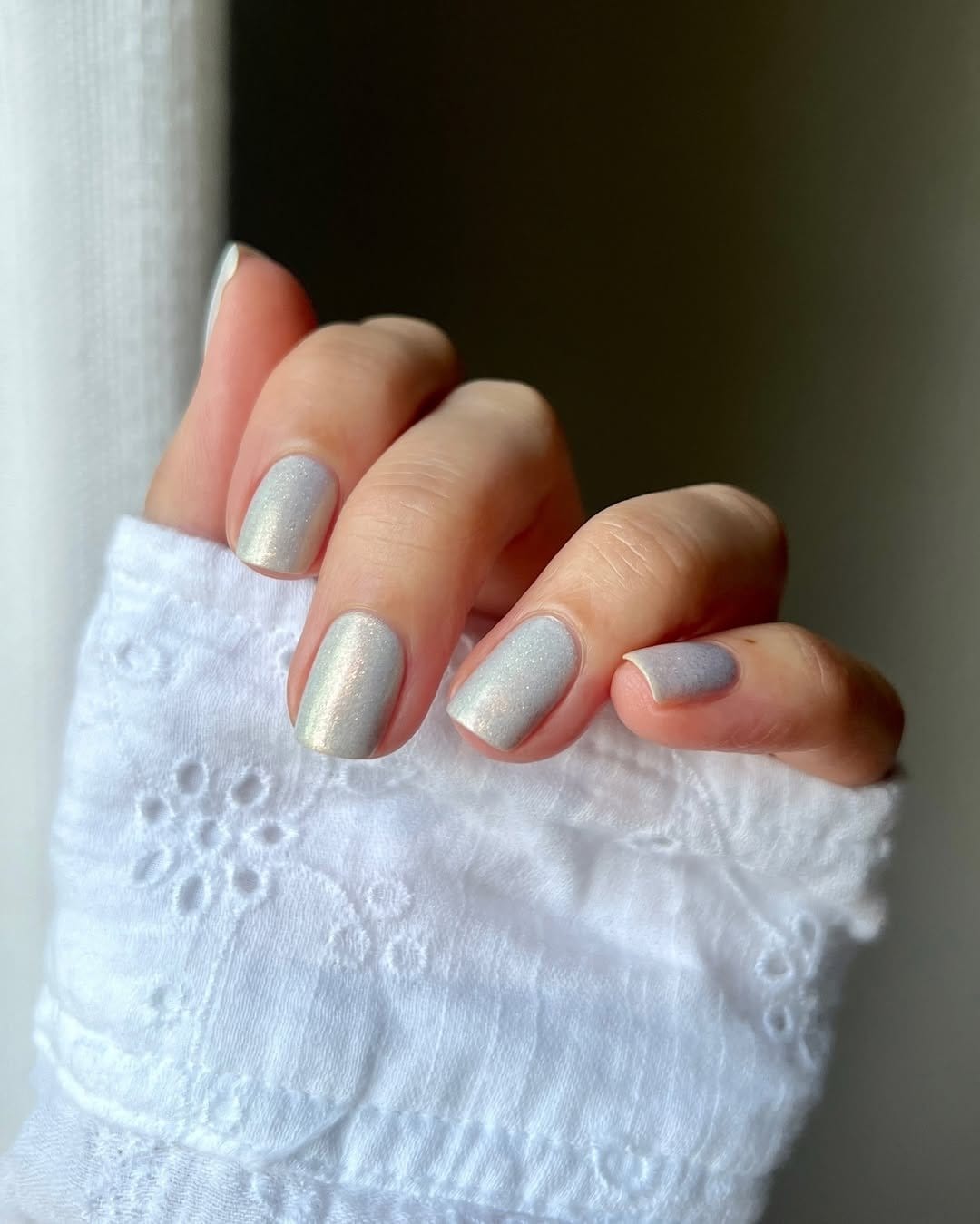 White nails with glitter jewel tones