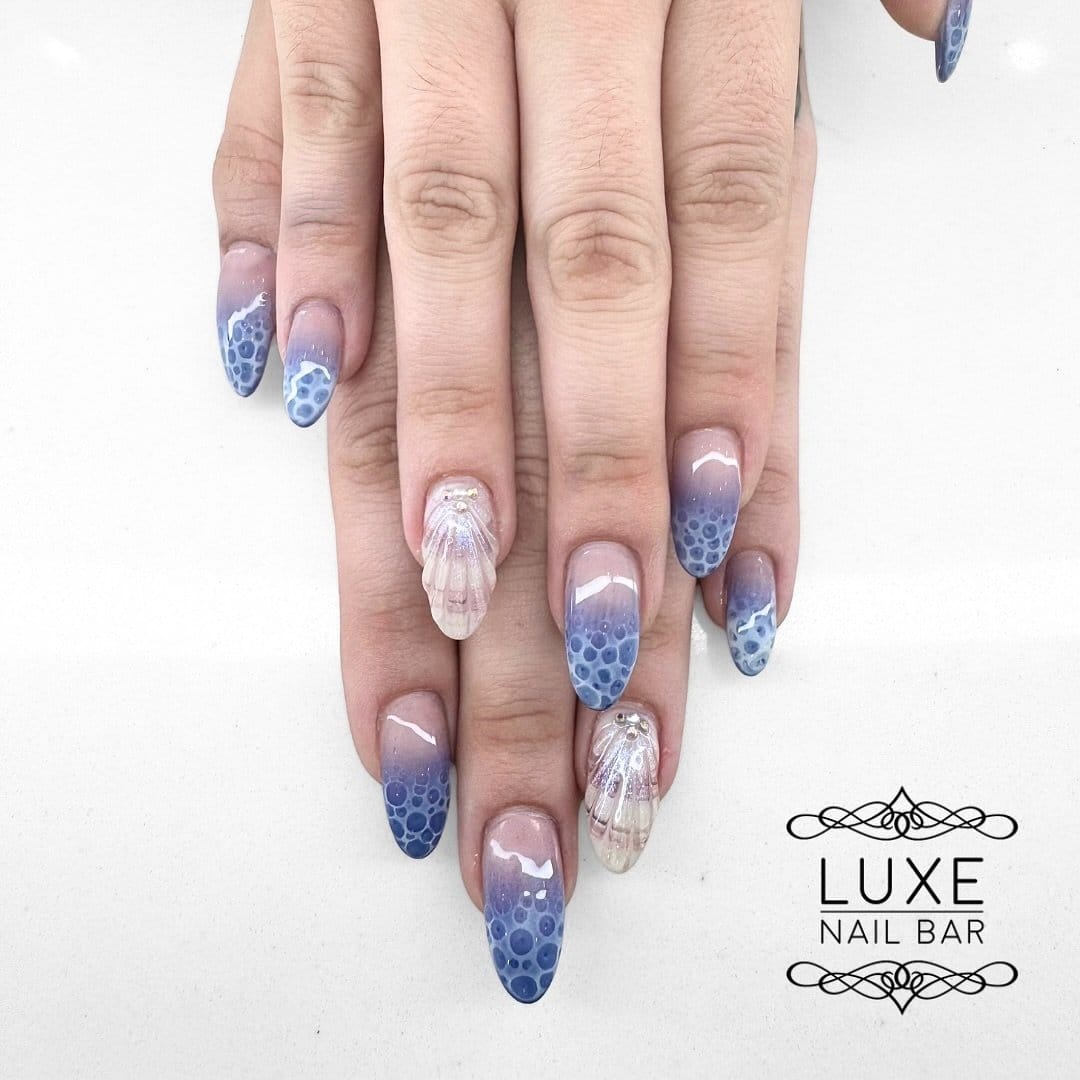 Breezy pastel blue ombre nails with sea mist