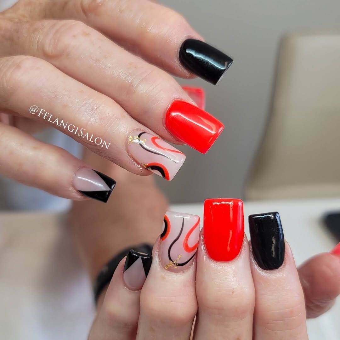 Red ombre nails with geometric shapes
