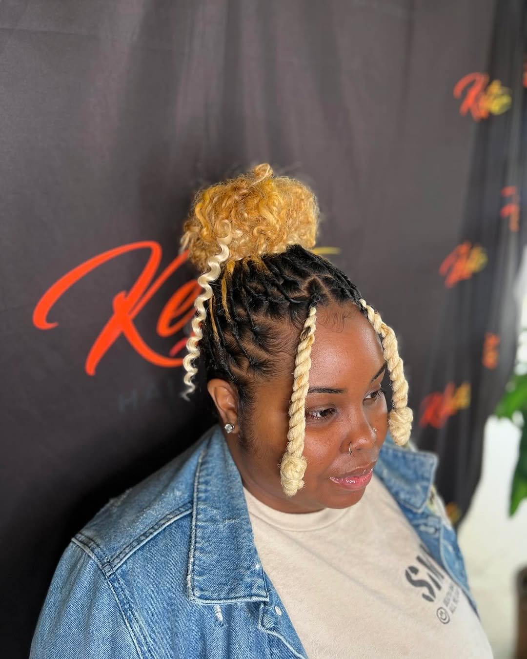 Playful double buns with short dreadlocks