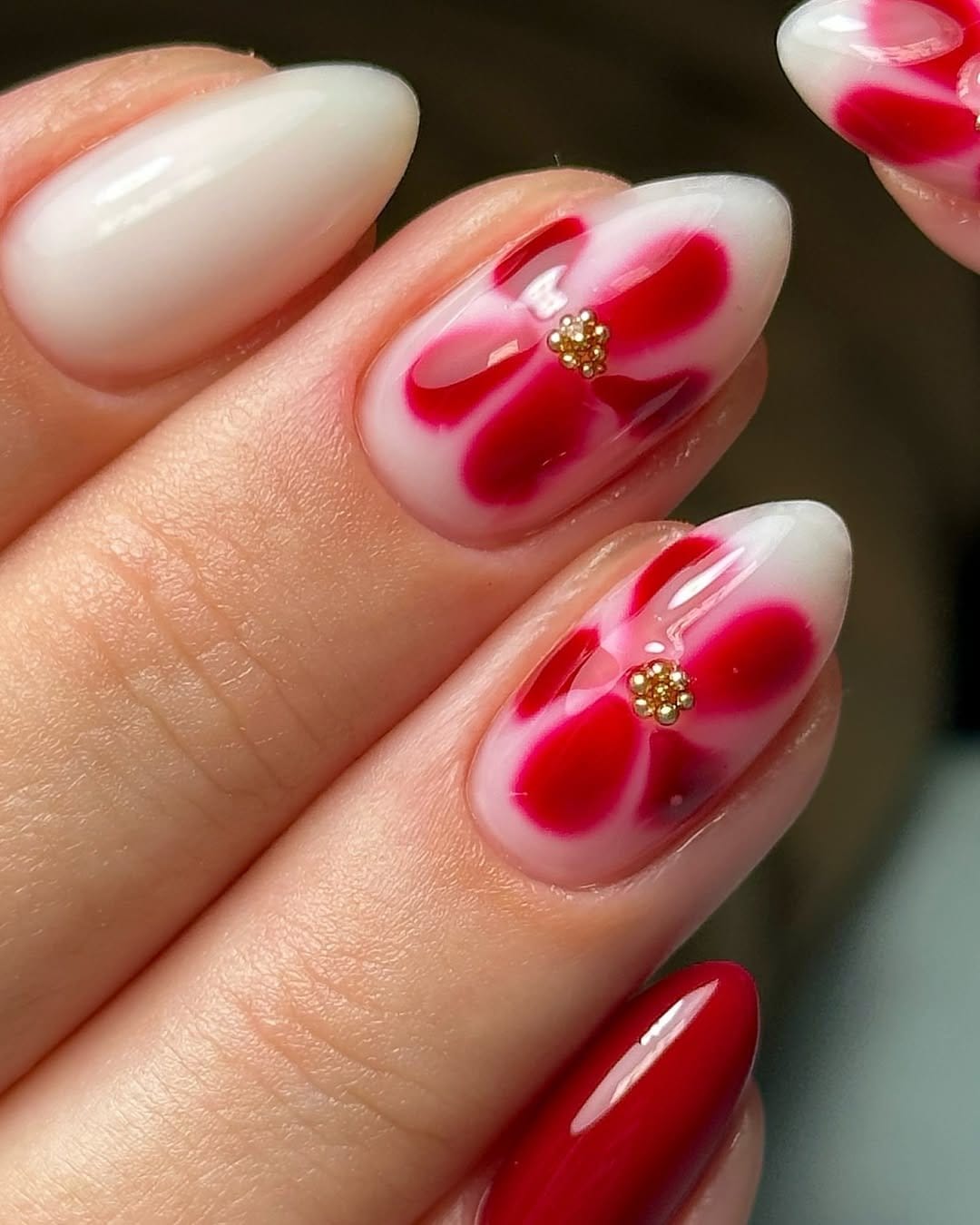 Matte white nails with blooming flowers