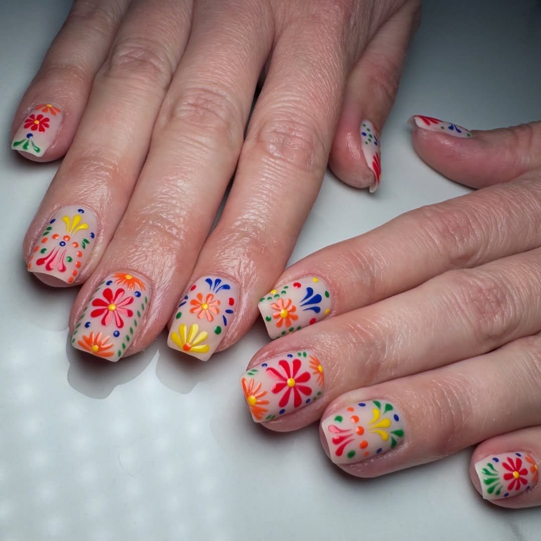 Fiesta-themed pastel floral nail art design