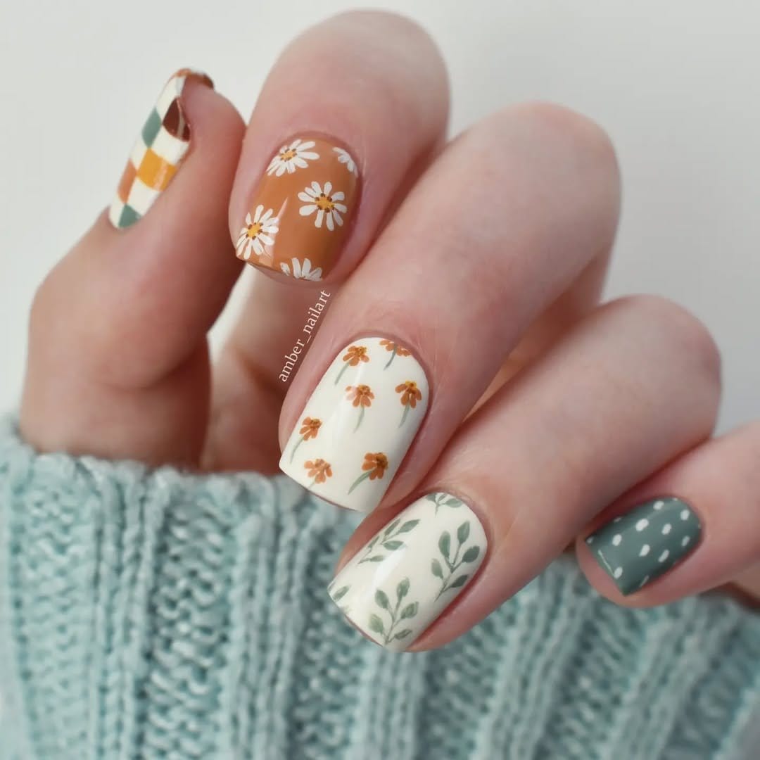 Bohemian-style floral nail art with earthy tones