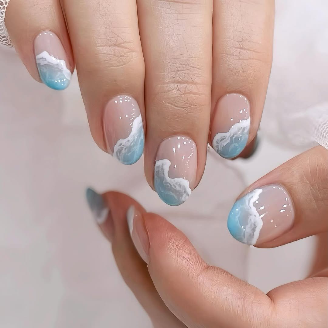 Ocean blue nails with wave designs