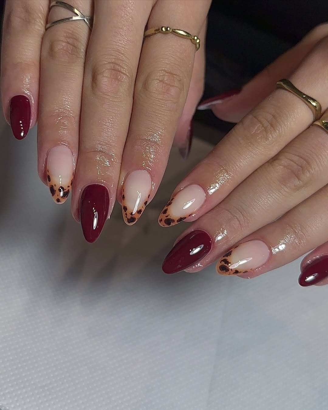 Red nails with leopard print accents