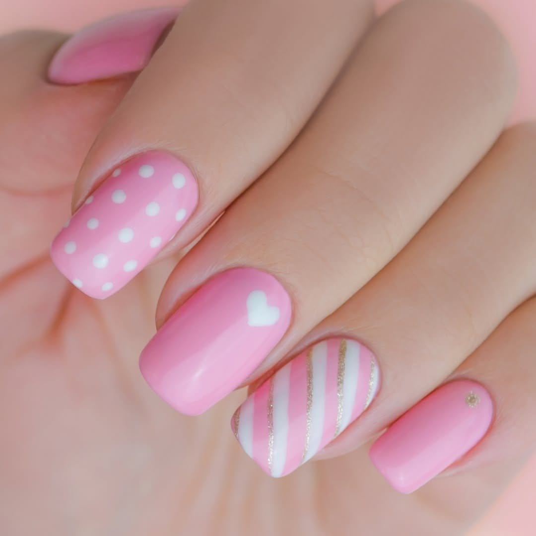 Playful pastel pink polka dot nails