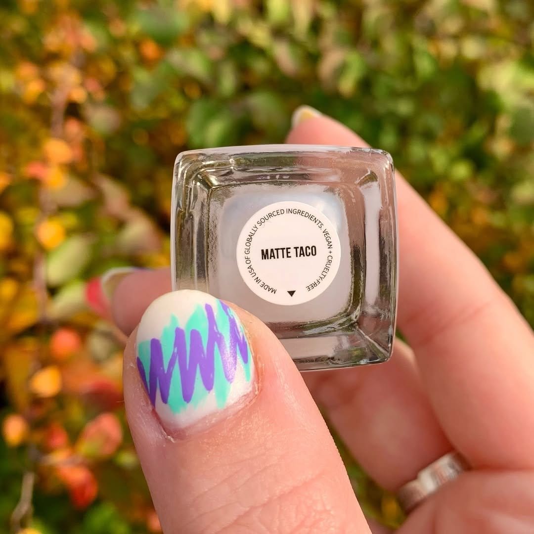 Lavender pastel nails with silver chevron pattern