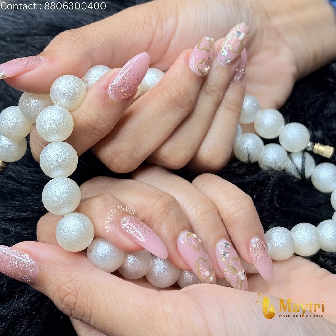 Nails with glitter and floral accents