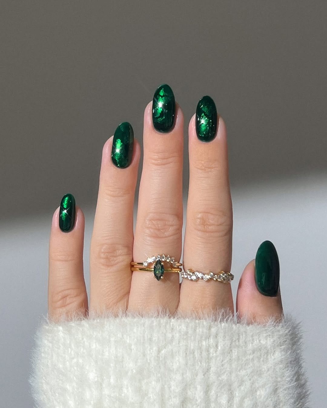 Red nails with silver glitter accents