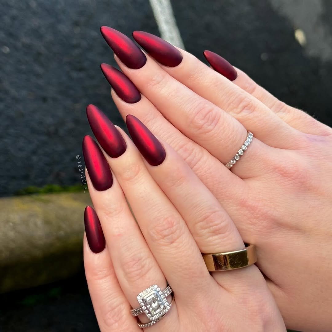 Matte red nails with a velvety texture
