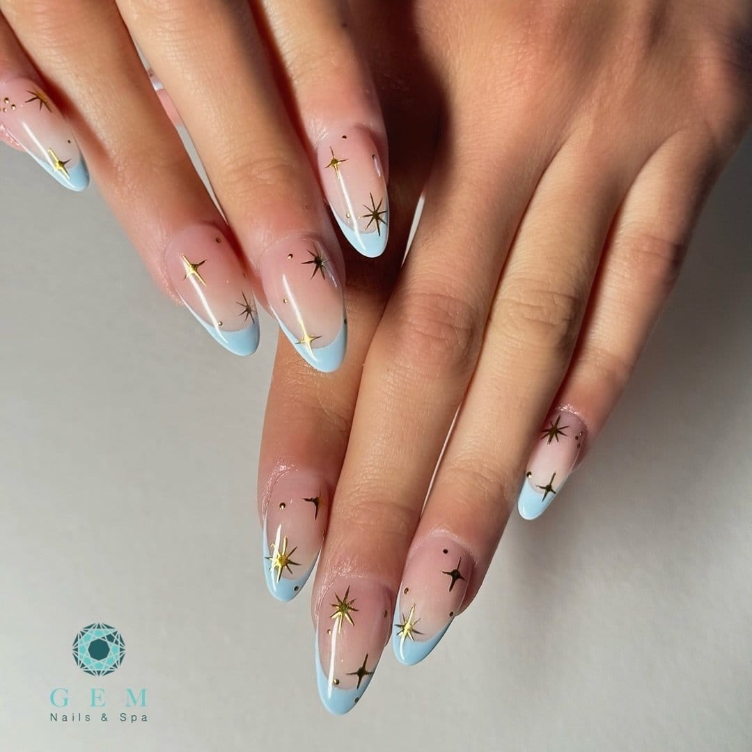 Soft baby blue French tips with tiny star accents