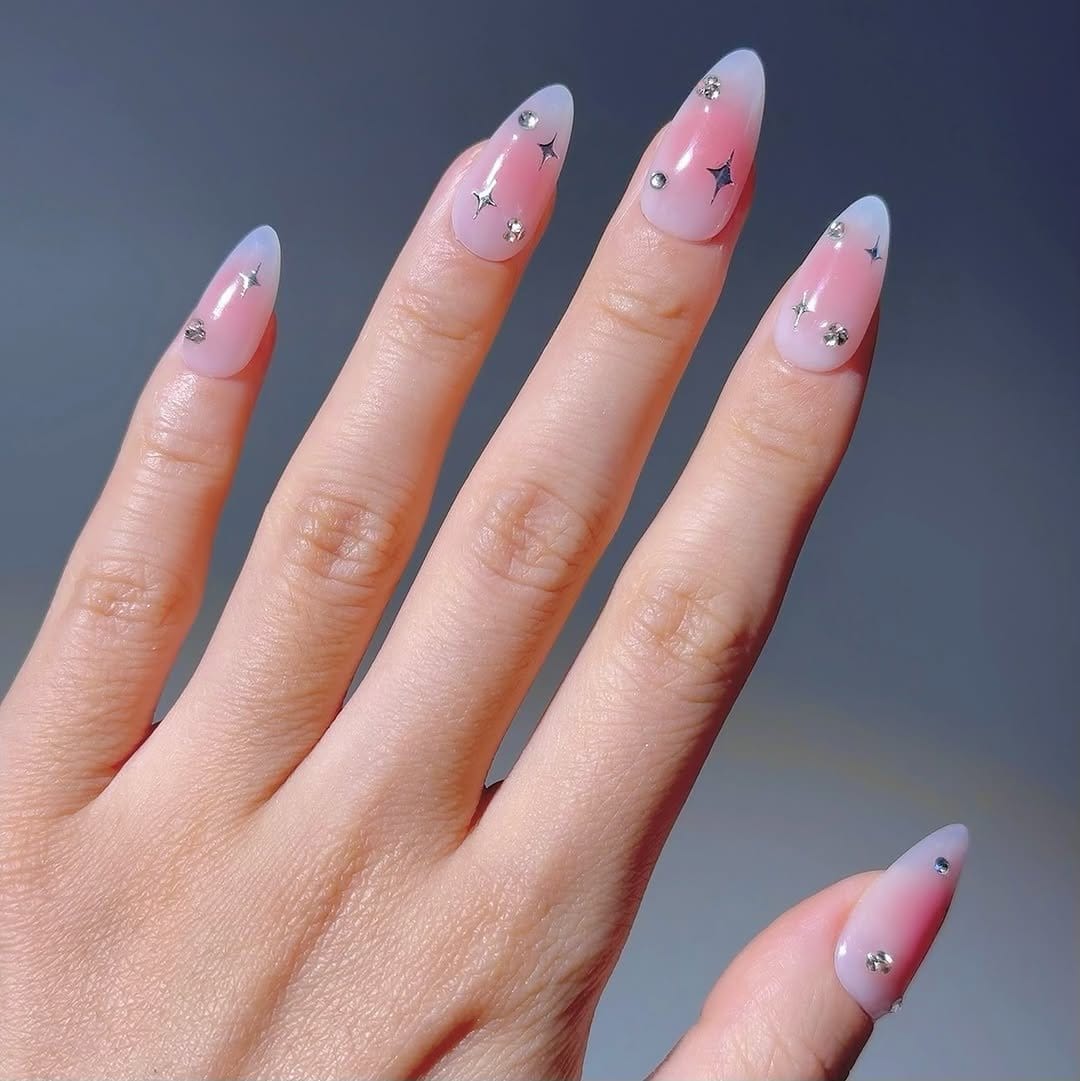 Pastel pink nails with tiny silver stars