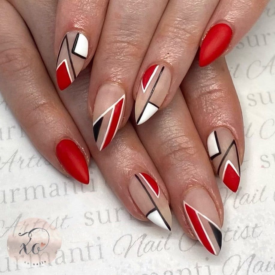 Red nails with white and black stripes