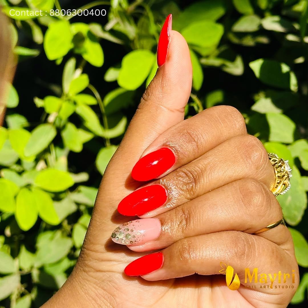 Red nails with sparkling rhinestones