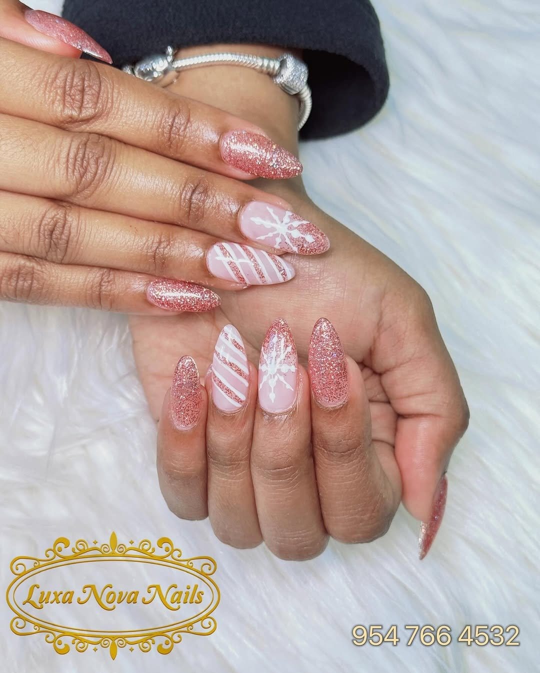White nails with striped glitter accents
