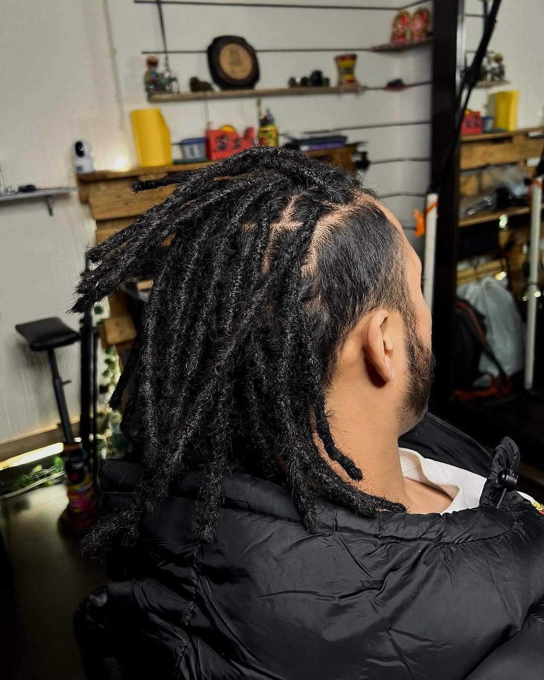 Braided sides with short locs mohawk