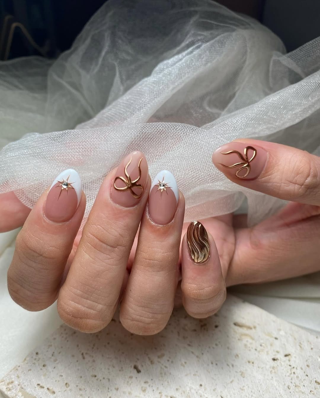Nude nails with gold accents
