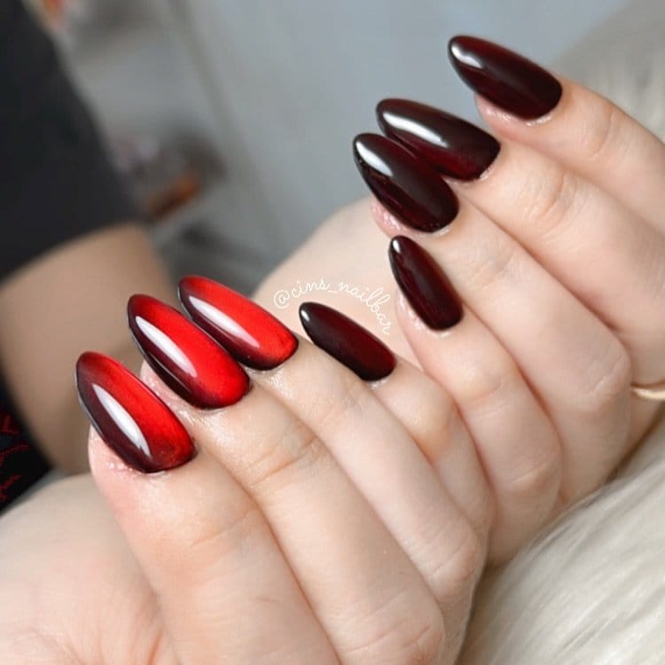 Red ombre nails with bold black tips
