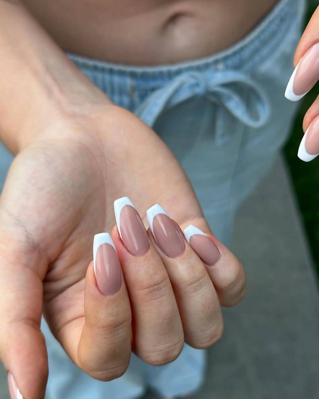 Simple pastel pink nails with thin white lines