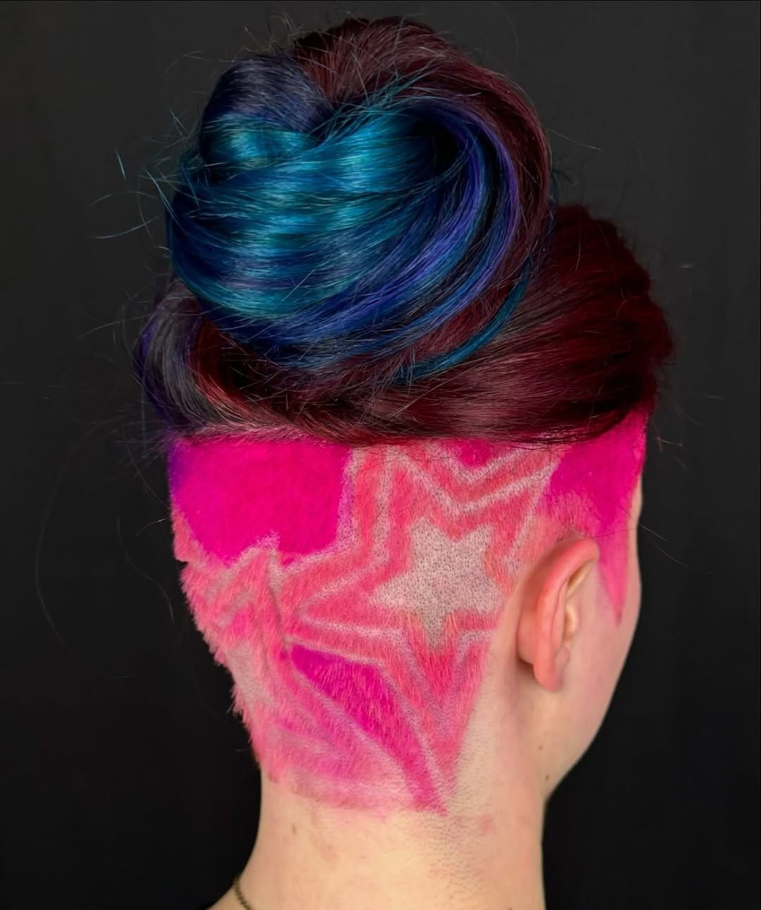 Short locs with intricate undercut patterns