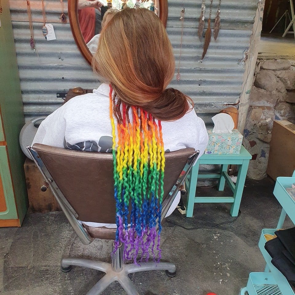 Vibrant rainbow-colored dreadlocks