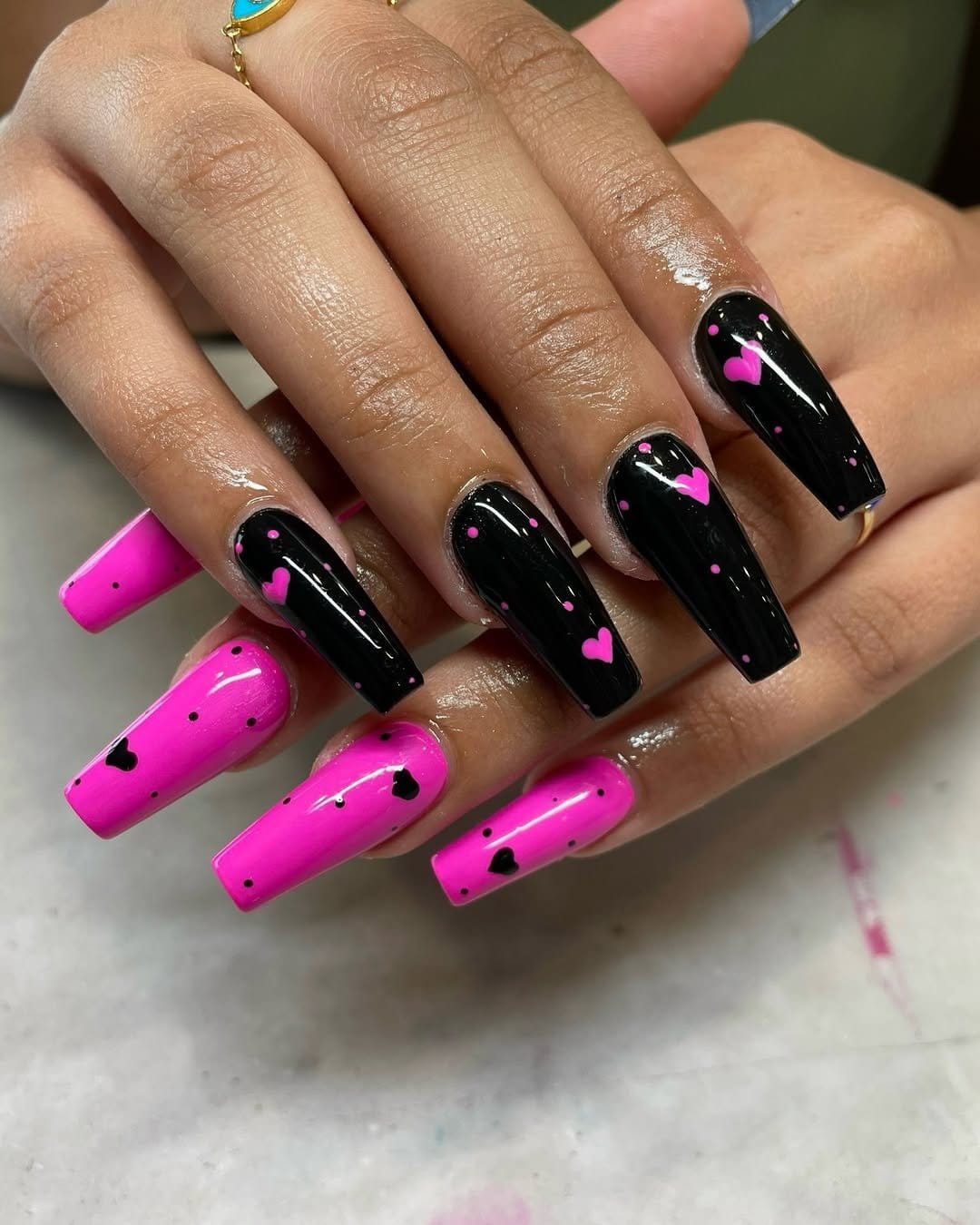 Heart designs on light pink nails