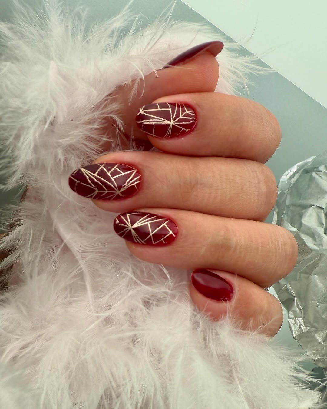 Red nails with geometric shapes