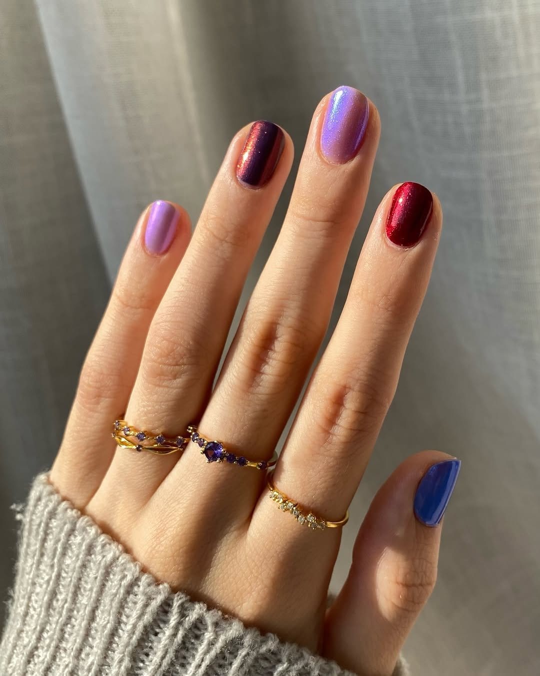 Bold peony floral nail art on pink background