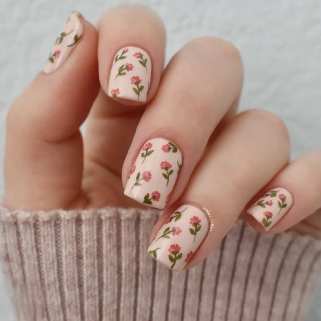 Colorful polka dot nail art on a pastel background