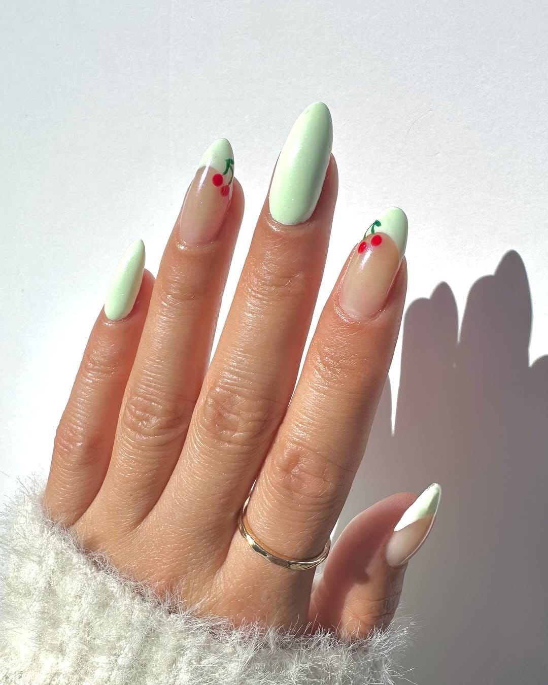 Mint green pastel summer nails close-up
